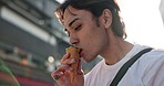 Walking, eating and Japanese man with ice cream in the city exploring on a summer vacation. Travel, dessert and young male person commuting in street for adventure in Yokohama town on weekend trip.