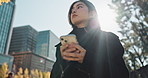 Outdoor, typing and Japanese woman with a smartphone, thinking and internet with sunshine, digital app and mobile user. Person, thinking and girl with a cellphone, contact and email notification