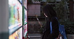 Woman, vending machine and night in city with decision for food, product or snack with click, press or coins. Japanese person, money and payment with slot for storage with meal on sidewalk in Tokyo