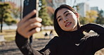 Japanese woman, selfie and park with smile for web blog, post and memory on walk, nature and morning. Girl, influencer or person with profile picture, photography or social network on app in Tokyo