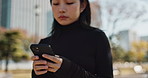 Outdoor, park and Japanese woman with a smartphone, thinking and internet with social media, typing and mobile user. Person, outside and girl with a cellphone, digital app and email notification