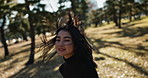 Woman, smile and running on park field for explore adventure, holiday travel or back view. Asian person, face and environment journey in nature or outdoor Tokyo, sunshine tourism or vacation trip