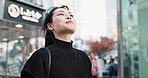 Japanese woman, happy and smartphone in city for connection and technology or wellness by outdoor. Young person, smile and cellphone in tokyo for social media, communication and online in urban town