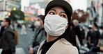 Japanese woman, face mask and busy city with walk, thinking and people on metro sidewalk for commute. Girl, person and ppe cover for pollution, virus and bacteria with urban travel on street in Tokyo