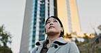 Japanese businesswoman, view and city to work, positive and wireless earphones for streaming playlist in morning. Young person, entrepreneur and listening to digital podcast and connection in town