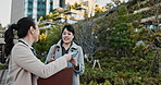 Business people, Japan and women with documents, speaking and conversation with greeting, bow and discussion. Hiroshima, manager and employee with paperwork, coworkers and collaboration with ideas