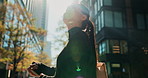 Asian, business woman and smile in city, walking for travel and lens flare with commute to work. Cityscape, metropolis or metro with professional in Tokyo, urban street and journey to workplace