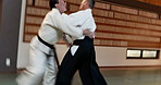 Men, aikido fighting and self defence for training, practice and black belt students for martial arts. Sensei, professional and technique with discipline, fighter and japanese with physical combat