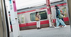 People, Japanese train station and waiting for transport, journey or metro railway for tourism. Commute, travel and infrastructure with men, women or walking on urban platform for locomotive in Tokyo