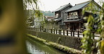 Winter, nature and Japanese architecture by a canal for landscape, travel or village culture. City, urban and homes, infrastructure and a river on a street for local history or a traditional town