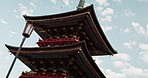 Japan, architecture and traditional temple in countryside with closeup and nature in outdoor with pagoda. Tokyo, heritage and buddhism building and ancient culture for religion, blue sky and city