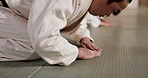 Black belt students, bow or master in dojo for aikido practice, discipline or self defense. Combat demonstration, Japanese people learning or training workout for fighting class or education on floor