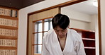 Martial arts students, bow or walking in dojo for aikido practice, discipline or self defense. Respect, Male Japanese people learning combat or training workout for fighting class or group education