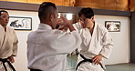 Men, aikido fighting or sensei for combat, training or black belt students for martial arts. Energy, professional or technique with discipline, fighter or Japanese people for self defence or practice