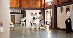 Men, aikido and sensei for combat, practice and black belt students for martial arts with training. Energy, professional and technique with discipline, fighter or Japanese people for self defence