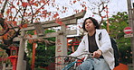 Bicycle, travel and man riding by building for exercise or transportation to college academy. Fitness, backpack and young male student driving a bike to university for carbon footprint by houses.