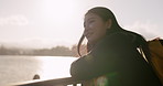 Japanese woman, lake and backpack with thinking, smile and sunrise on adventure, trip or vacation. Girl, person and happy for holiday with bag, vision and memory by water, river and bridge in Tokyo