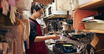 Japanese chef man, pan and kitchen with chopsticks for cooking, meal prep and job in catering services. Person, restaurant worker and thinking with recipe for cuisine, fast food or cafeteria in Tokyo