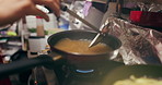 Cooking, sauce and person with pan on gas stove at food market for meal preparation, eating and nutrition. Restaurant, flame and closeup of utensils to prepare lunch, cuisine dinner and supper