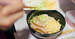 Japanese, ramen and food in restaurant with spring onion and ingredients, chopsticks and chef skill with decoration. Person cooking traditional cuisine, closeup with nutrition and garnish on noodles