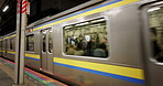 Train, moving and platform or public transport in Japan for commute, travel or safety. Locomotive, trip and cart departure in city for vehicle adventure or urban metro for express, speed or journey