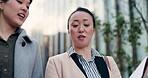 Walking, city and women speaking about report for business, collaboration or coaching in Japan. Corporate, help and Japanese employees talking about paperwork or a document for professional teamwork