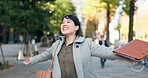 City, celebration or Japanese woman excited by work promotion, achievement or success. Professional person, happy winner or walking in street for goal, energy or career growth with gratitude or smile