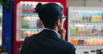 Vending machine, business man and choice, decision or thinking of automatic service technology at night in city outdoor. Back, shopping and hungry professional customer in urban town in Tokyo Japan