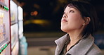 Vending machine, woman and payment in city at night, automatic digital purchase or choice of food outdoor. Dispenser, shopping and Japanese person press button on technology in urban town in Tokyo