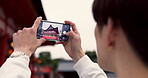 Phone, hands and tourist with picture in Japan on vacation, holiday trip or travel. Smartphone, person and closeup photography of Fushimi inari-taisha temple in Kyoto on mobile technology outdoor