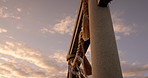 Torii gate, sunset and sky in Japan with clouds, zen and spiritual history on travel adventure. Shinto architecture, Asian culture and calm nature on Japanese landscape with sacred monument at shrine