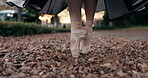 Ballet, feet and pointe or dancer outdoor in nature for professional street performance, practice or spin. Shoes, leaves and closeup in Japanese garden or artist expression, creative or entertainment