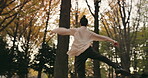 Woman, ballerina and pirouette in nature for dancing performance, outdoor or spinning. Female person, pointe and forest or woods in Japanese garden for artistic talent for practice, ballet or skill