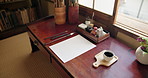 Art, paper and calligraphy tools in artist studio with creative brushes, pencil and ink for illustration. Japanese sumi, document and home isolated with drawing, creation and creativity for painting