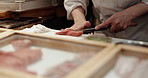 Cooking, hands and chef knife in a Japanese restaurant with catering, fish and dish in a kitchen. Menu, salmon and fine dining with sushi table, chop and person with food and sashimi for dinner