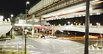 Night cityscape, traffic and train by road, railway or motion blur for transportation infrastructure. Monorail locomotive, cars and street for travel, driving or direction for urban location in Tokyo
