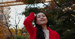 Outdoor, thinking and Japanese woman in a park, freedom and journey with vacation, daydreaming and wonder. View, outside and person with nature, relax or sunshine with wellness, holiday and adventure
