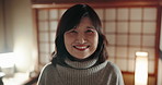 Face, smile and a Japanese woman at home, house and alone in apartment at night. Happy portrait of confident mature female person, cheerful and healthy facial expression of casual lady in living room