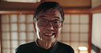Face, smile and a senior Japanese man at home, house and alone in apartment at night. Happy portrait of confident mature male person in glasses, cheerful and healthy facial expression in retirement
