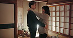 Mature couple, dancing and happy together or love in home, communication and security or connection. Asian people, smiling and celebration of anniversary, support and embrace or trust and loyalty