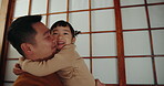 Daddy, daughter and hug for bonding at home, love and happiness for care in childhood or parenthood. Asian family, father and child embrace for connection, security and support or relaxing together