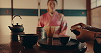 Hands, teapot and Asian women with tea with traditional leaves and indigenous herbs in home. Health, ceremony and people with herbal beverage for relaxing, wellness and detox for drinking ritual