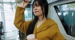 Japanese woman, train and coffee cup on travel for commute, city or adventure in metro, direction or location. Asian business person, transportation and tea for journey, thinking and ideas in Tokyo