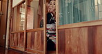 Close, door and traditional woman in Japan in kimono, fashion or architecture with wood. Asian, home and person in morning with sliding entrance to house with hospitality, routine or welcome