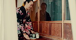 Japanese, tea and traditional woman with service of matcha, ginseng and open door with a tray. Asian, culture and calm master in kimono with respect for hospitality, indigenous heritage and beverage