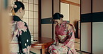 Japanese, ceremony and women bow with tea, matcha or welcome with hospitality and happiness. Traditional, culture or friends in kimono with conversation of indigenous heritage service of beverage