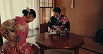 Japanese, tea and women bow in ceremony with matcha, ginseng and hospitality with happiness. Traditional, welcome or friends in kimono with indigenous heritage, culture and conversation with beverage