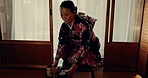 Traditional, ceremony and woman with Japanese tea, service and bow with matcha on tray. Asian, culture and calm master in kimono with respect for hospitality, heritage and preparation of beverage