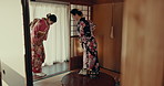 Women in traditional Japanese bow with bow, kimono and welcome in tea room with mindfulness, smile and hello. Happy friends meeting at calm teahouse with greeting, respect and zen culture in home.