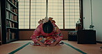 Woman, traditional prayer for religion in Japan tatami room for spiritual healing, wellness or gratitude. Female person, kimono dress and god worship on floor for holy respect, forgiveness or hope
